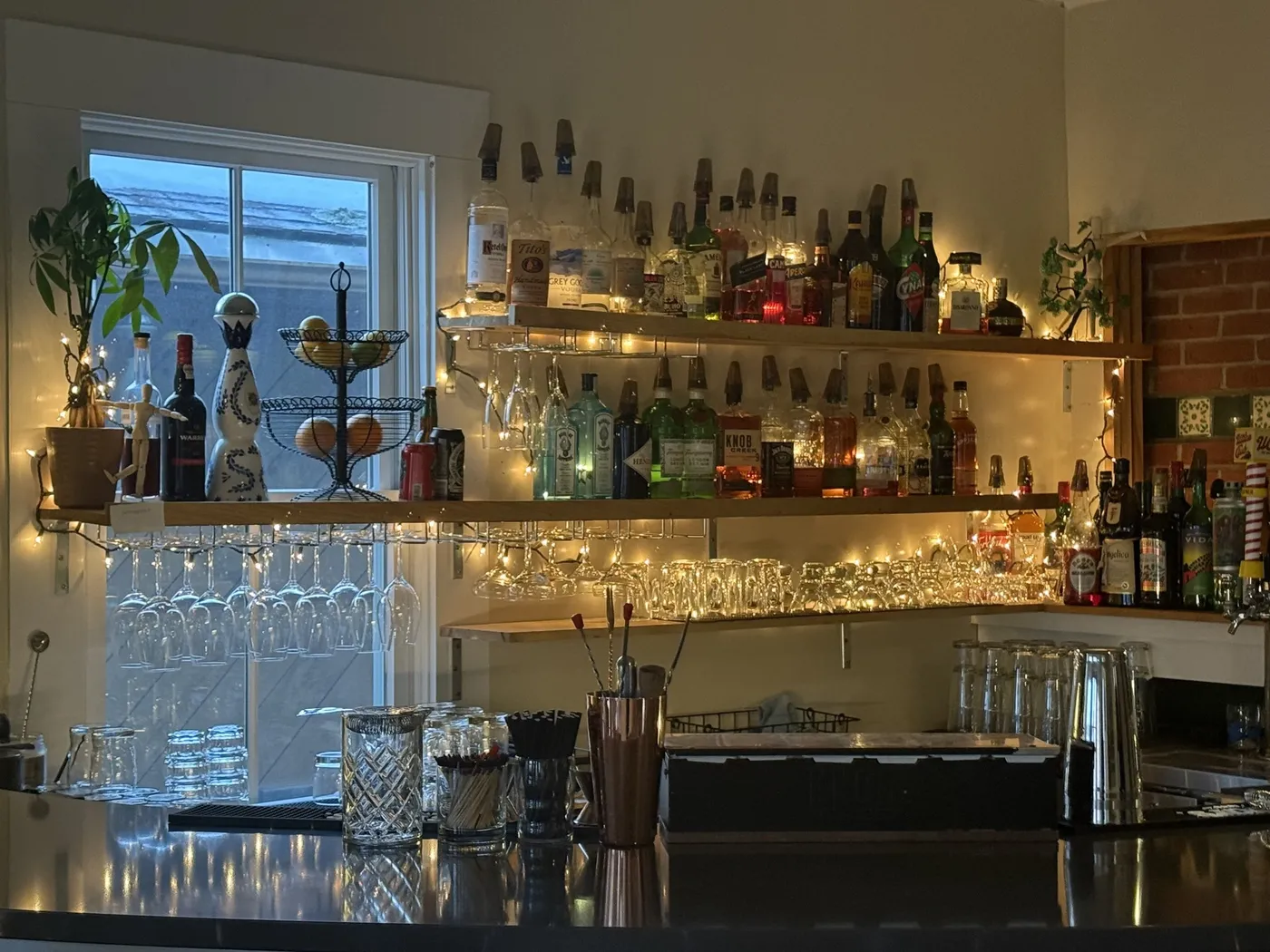 13 Oak's bar, stocked with spirits and string lights