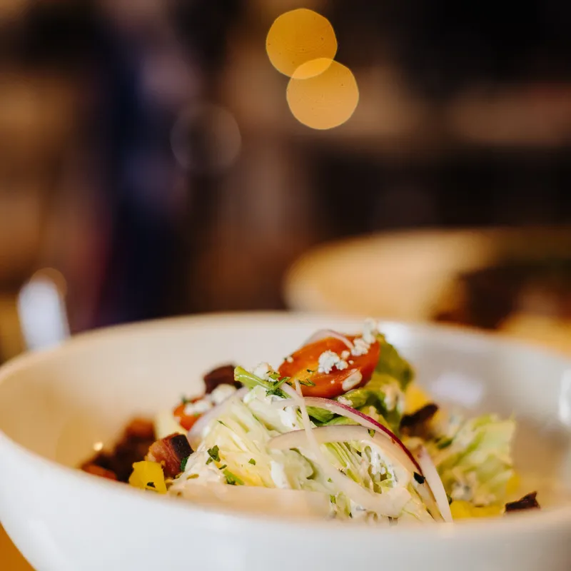 Wedge salad with blue cheese, bacon, and red onion