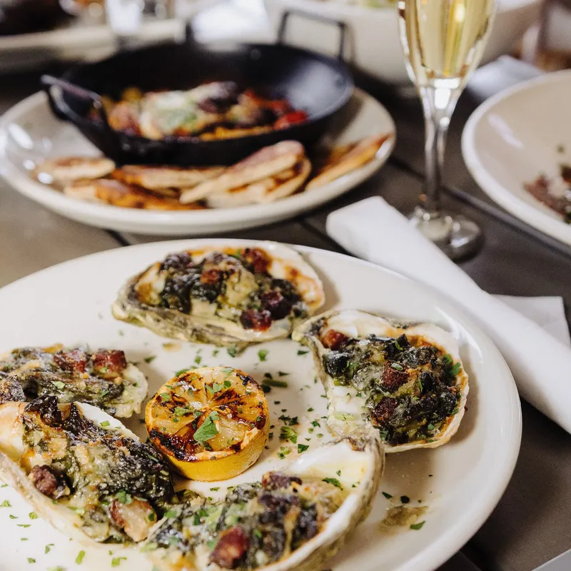 Baked oysters with garlic butter and grilled lemon