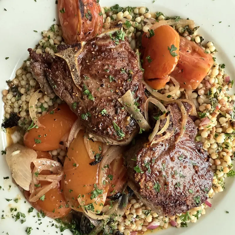 Grilled chops with roasted tomato and couscous