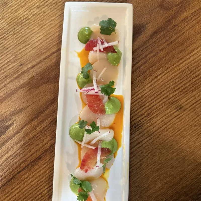 Scallop crudo with citrus and herb oil