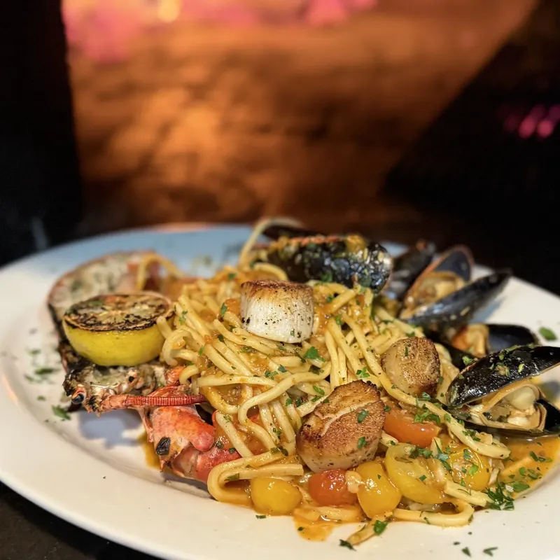 Seafood pasta with mussels, scallops, and lobster